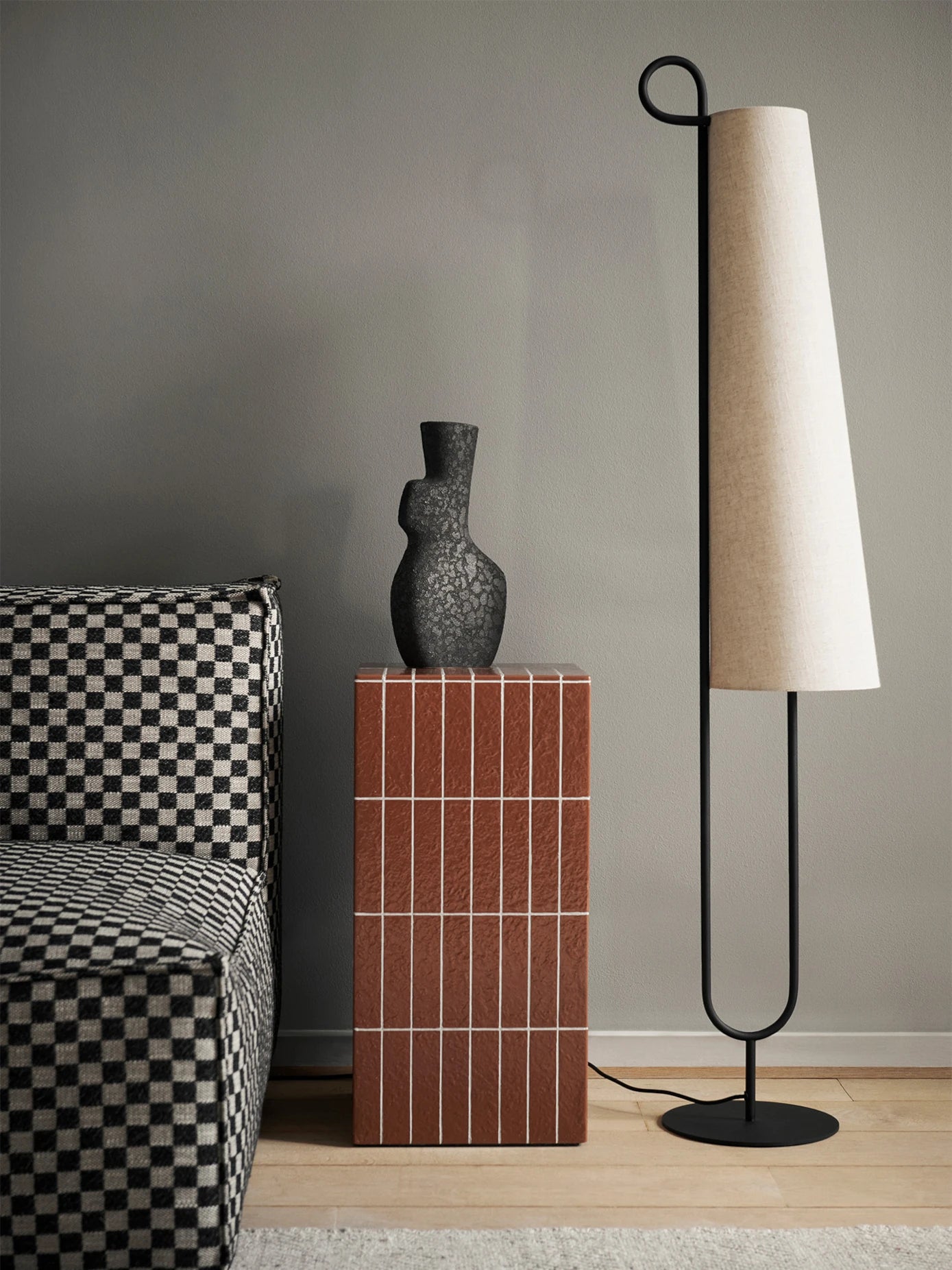 Acrona floor lamp by ferm Living in a living room setting at Lifestory