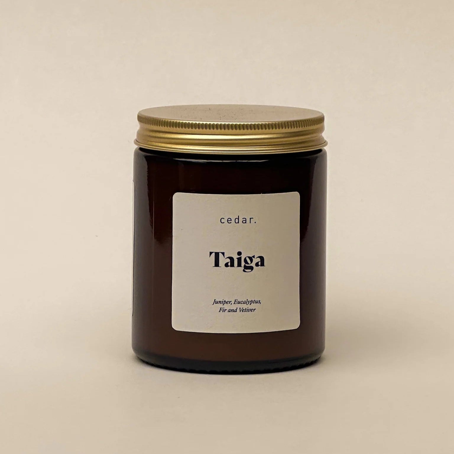 Cedar Lifestyle Taiga Medium Candle in brown glass jar with gold lid