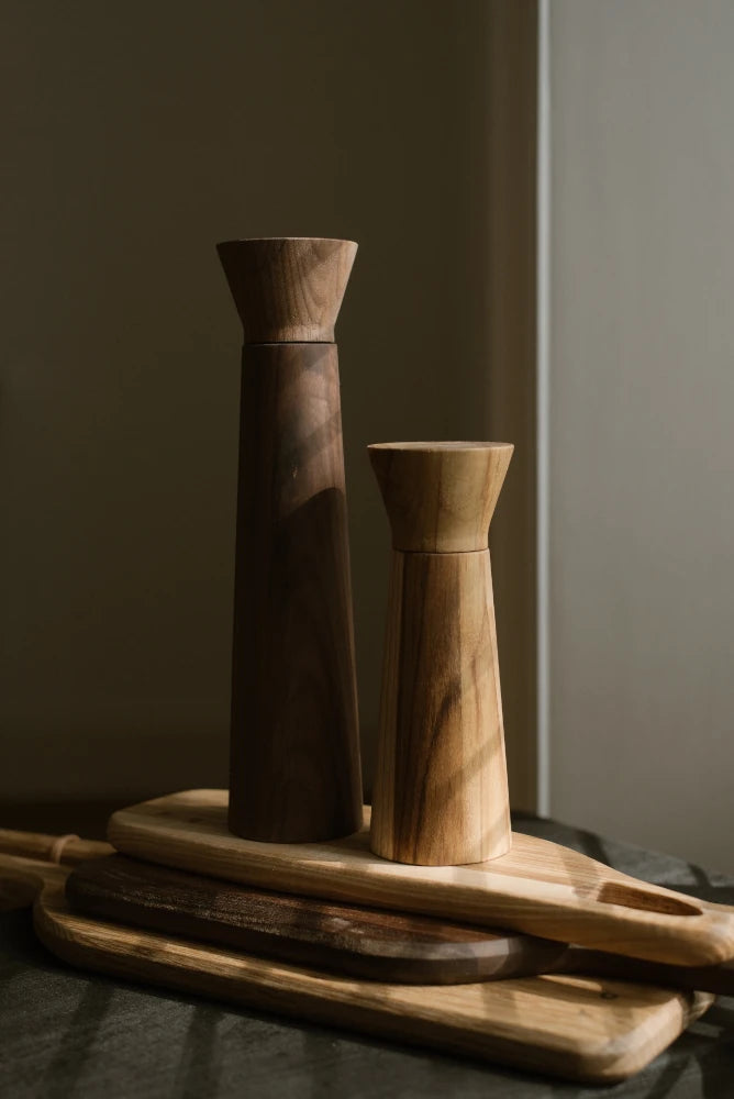 Teak salt mill and mahogany peper grinder and chopping boards by The Conran Shop - Lifestory