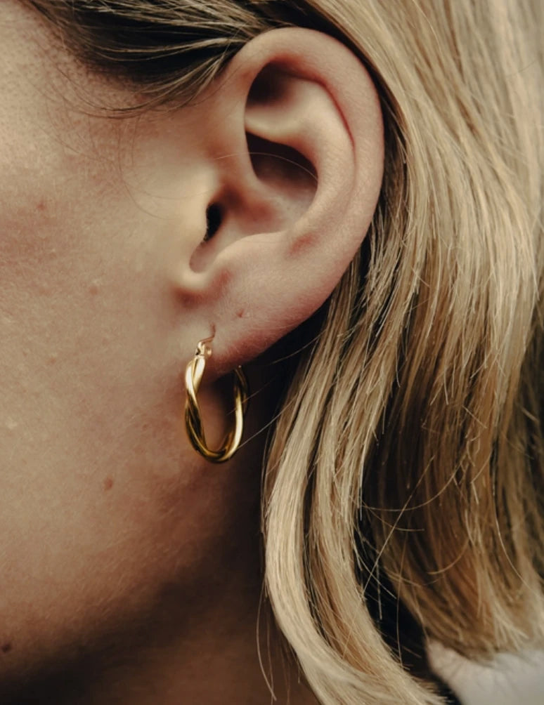 Gold Medium Entwined Hoop Earrings on models ear by Nordic Muse at Lifestory