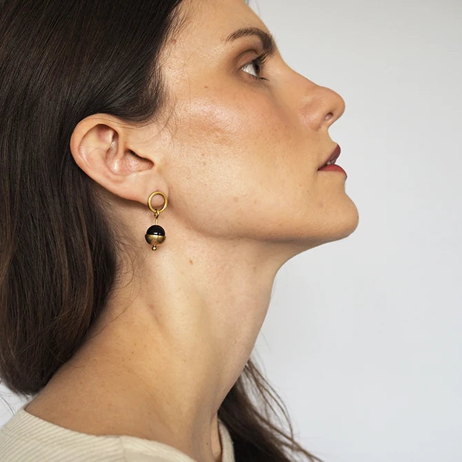 Profile image of a female model wearing Form Brass Circle, black Bead & Cup Earrings by brass+bold from Lifestory Edinburgh