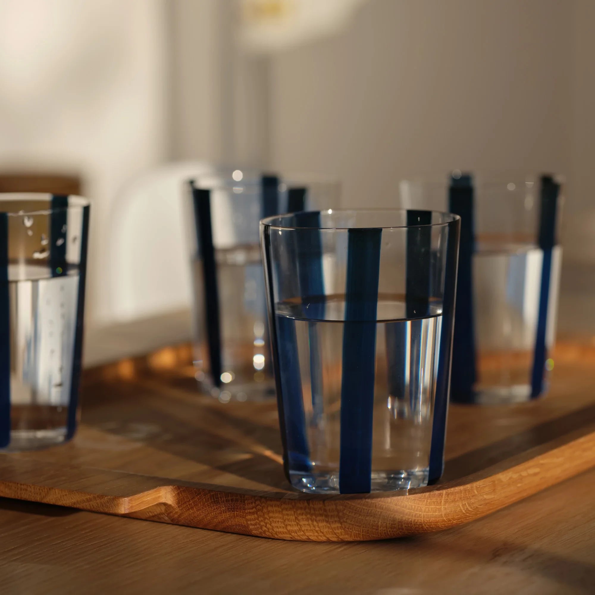 Nova Stripe Tall Glass Tumbler Set of 4 in navy by The Conran Shop at Lifestory