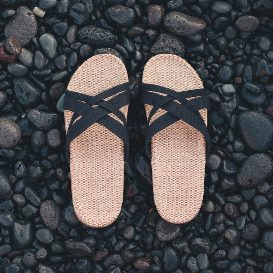 pink heart of pebbles, top view, pink sandals - SuperStock