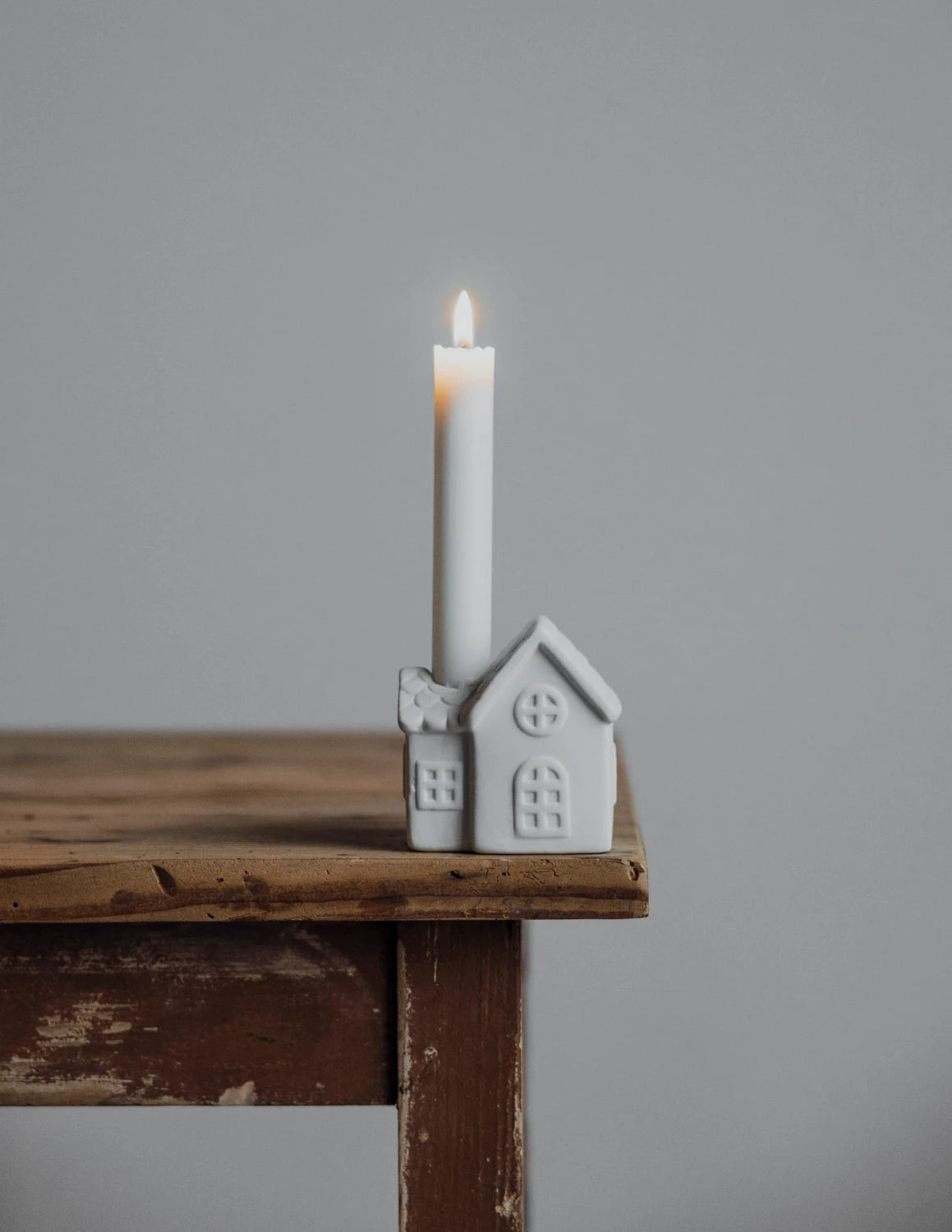 White Ceramic Candle Holder - Ljusstaden Nr 2 by Storefactory on a table top | Lifestory