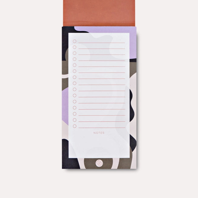 The Completist Juno To Do List Pad lying open on a white background