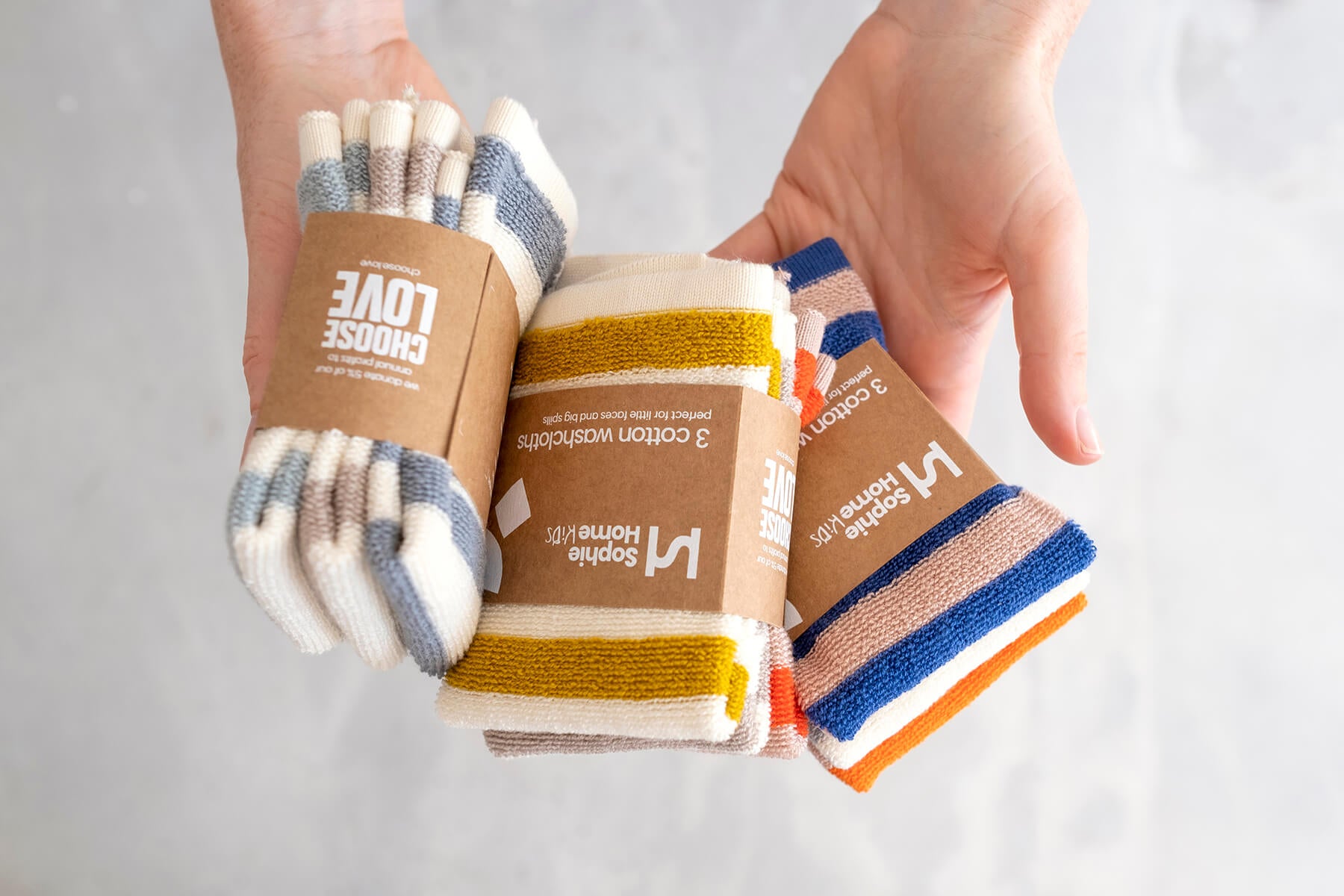 https://www.lifestoryshop.com/cdn/shop/files/Washcloth-Packaging-InHand-Lifestyle-SophieHome-WCTH-ALL-Lifestory.jpg?v=1701272872&width=1800