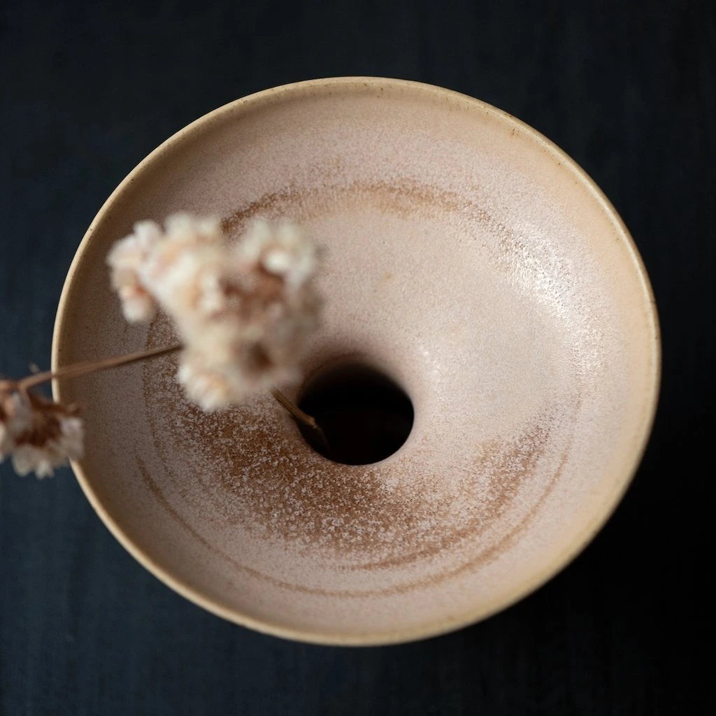 Ceramic Vase in Plaster Colourway by Angus Henderson holding a single stem of flowers viewed from above