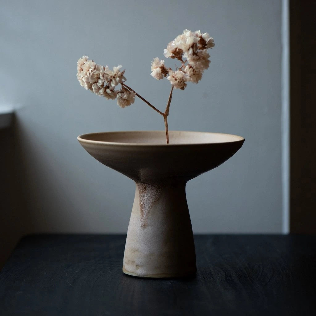 Ceramic Vase in Plaster Colourway by Angus Henderson holding single stem of flowers