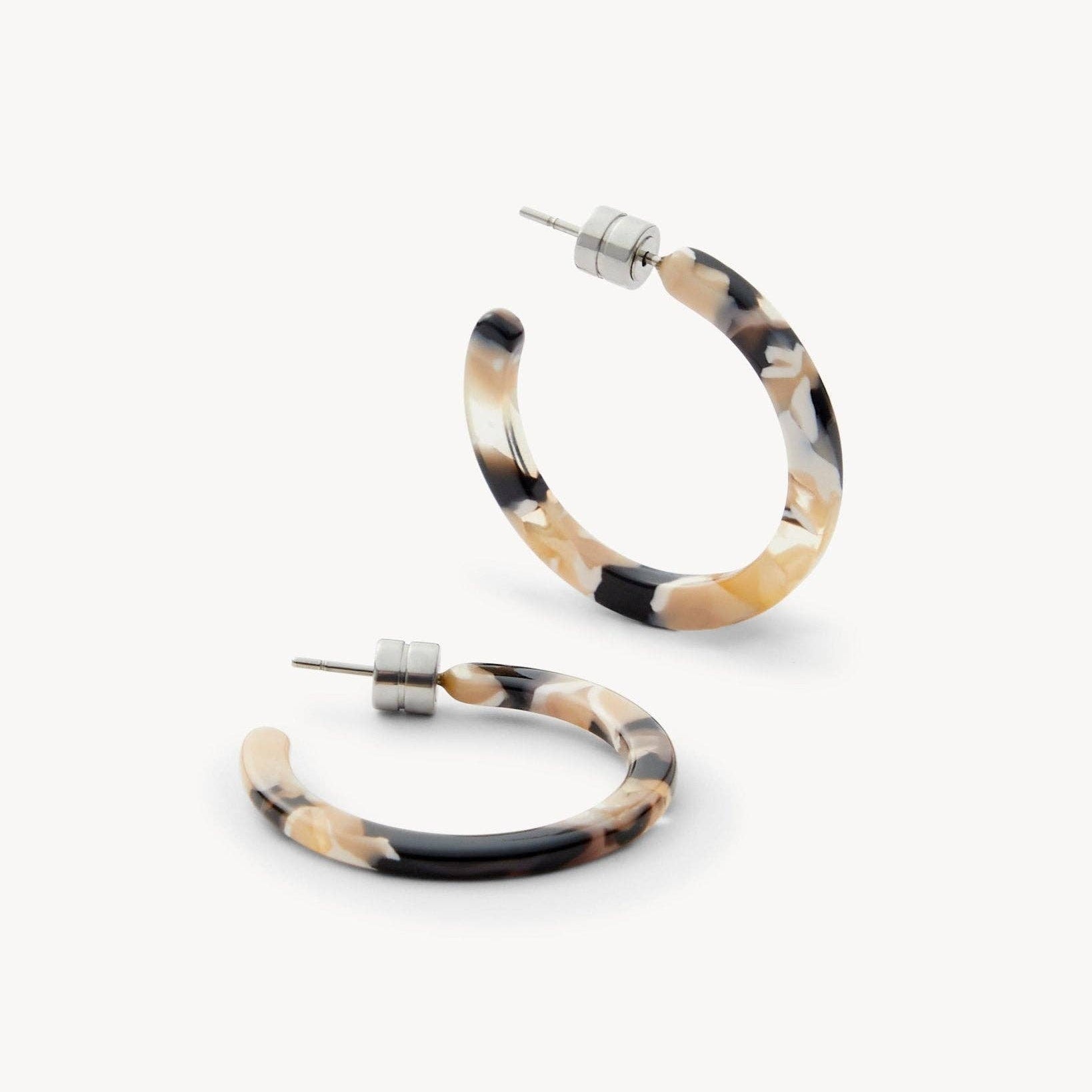 MACHETE Mini Hoops in Abalone Acetate on a white background at an angle