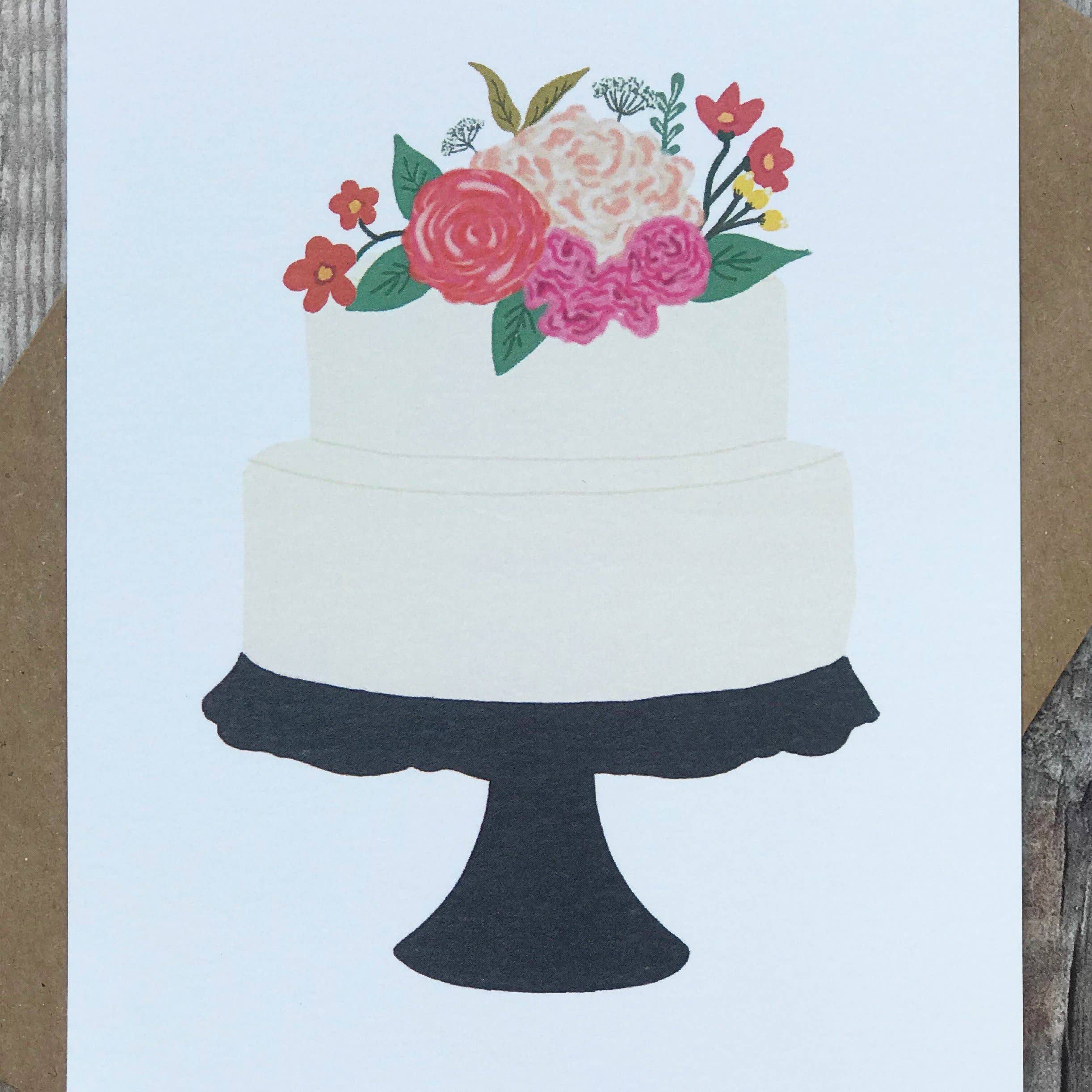 Close up of Wedding Cake Card by Lomond Paper Co on a wooden background